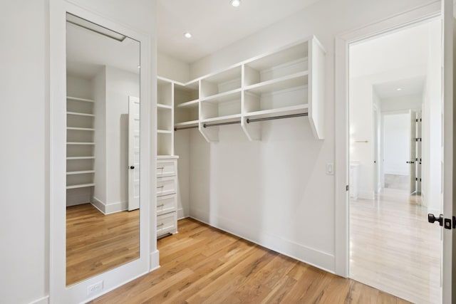 walk in closet featuring light wood-type flooring