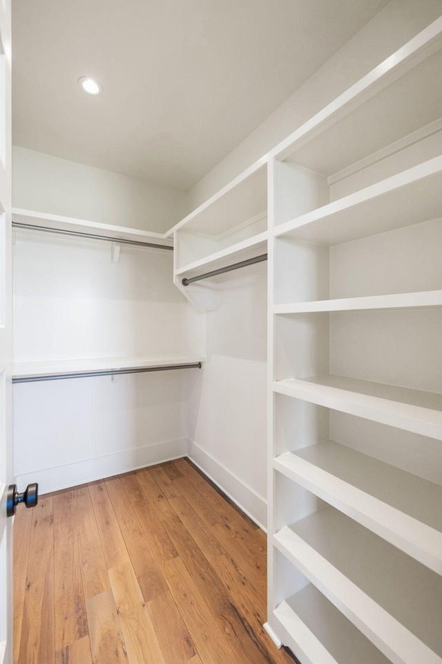 spacious closet featuring wood finished floors