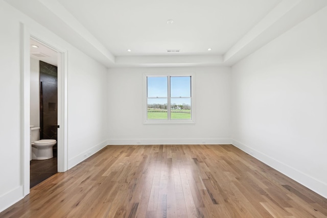 unfurnished room with light wood-style flooring, recessed lighting, baseboards, and visible vents