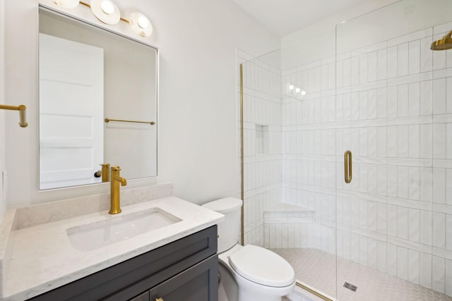 full bath with a shower stall, toilet, and vanity