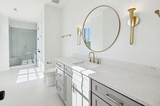 full bathroom featuring visible vents, toilet, vanity, a stall shower, and tile patterned flooring