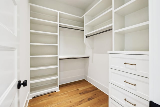 walk in closet featuring light wood-type flooring