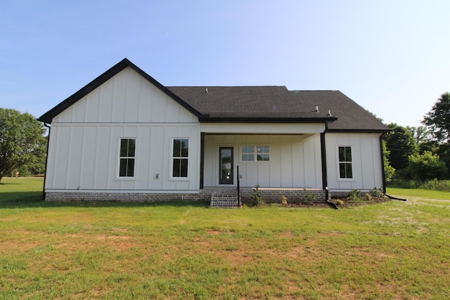 2111 Horton Way, Lewisburg, TN 37091 - rear view of property featuring board and batten siding, a lawn, and roof with shingles
