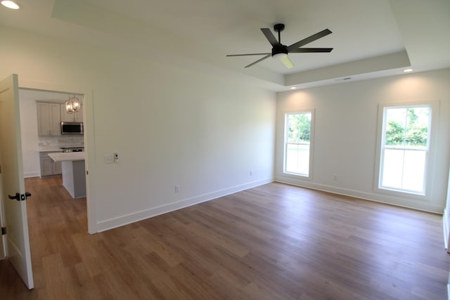 2111 Horton Way, Lewisburg, TN 37091 - unfurnished room with a raised ceiling, plenty of natural light, wood finished floors, ceiling fan, and recessed lighting