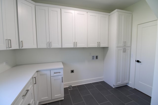 2111 Horton Way, Lewisburg, TN 37091 - laundry room featuring cabinet space, electric dryer hookup, hookup for a washing machine, dark tile patterned floors, and baseboards