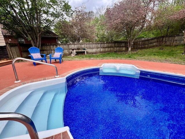 view of pool featuring a fenced in pool, a fenced backyard, and a patio area