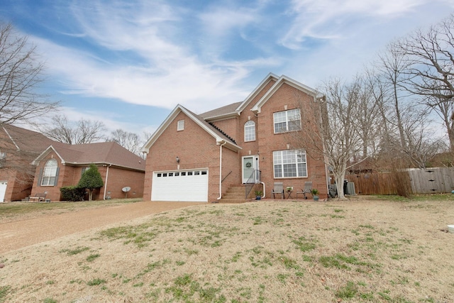 traditional home featuring fence, a garage, brick siding, driveway, and cooling unit
