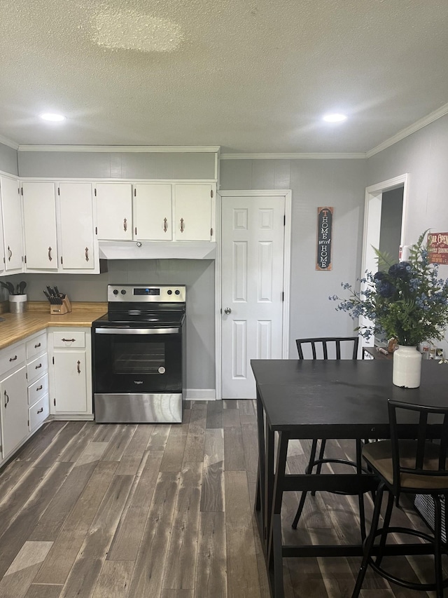 kitchen with dark wood-style floors, white cabinetry, stainless steel range with electric cooktop, and ornamental molding