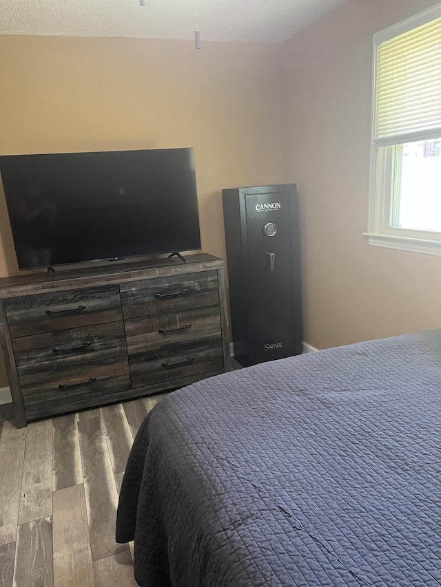 bedroom featuring wood finished floors