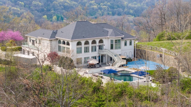 720 Valhalla Ln, Brentwood, TN 37027 - rear view of house with a patio, a forest view, fence, and stairs