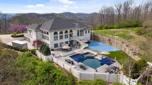 720 Valhalla Ln, Brentwood, TN 37027 - back of house featuring a wooded view, a fenced backyard, a patio, and stairs