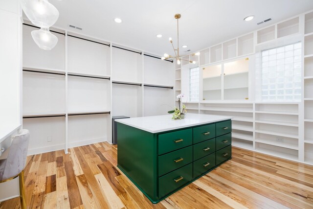 720 Valhalla Ln, Brentwood, TN 37027 - spacious closet featuring a chandelier, light wood-style flooring, and visible vents