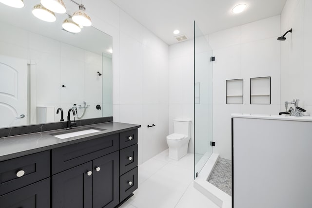 720 Valhalla Ln, Brentwood, TN 37027 - bathroom featuring vanity, a stall shower, tile patterned flooring, toilet, and tile walls