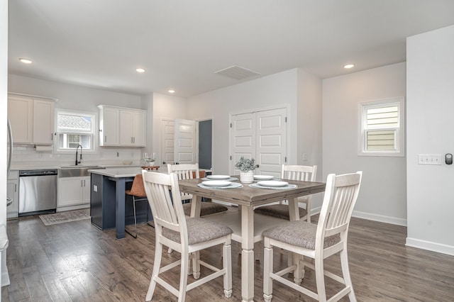 dining area featuring dark wood-style flooring, baseboards, visible vents, and recessed lighting