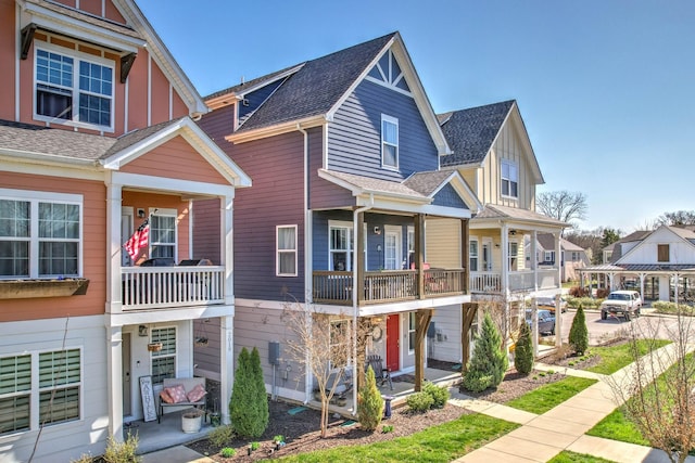 view of front of home with a residential view and roof with shingles