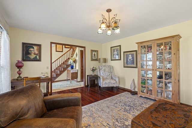 1737 Bratton Ln, Williamsport, TN 38487 - living area with stairs, wood finished floors, a chandelier, and baseboards