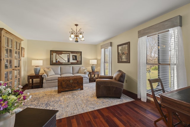 1737 Bratton Ln, Williamsport, TN 38487 - living room with wood finished floors, a chandelier, a healthy amount of sunlight, and baseboards