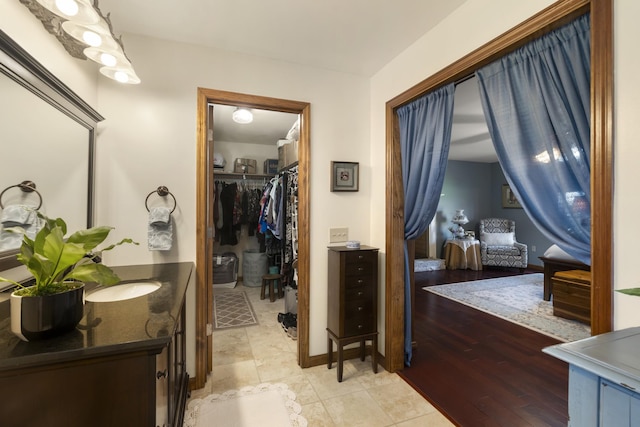 1737 Bratton Ln, Williamsport, TN 38487 - bathroom featuring a spacious closet and vanity