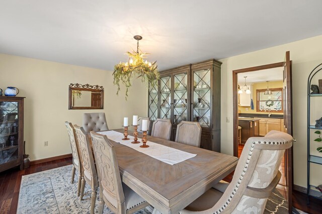 1737 Bratton Ln, Williamsport, TN 38487 - dining room with an inviting chandelier, wood finished floors, and baseboards