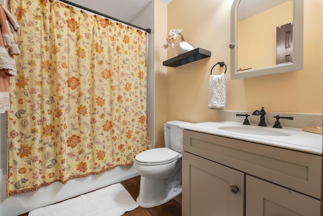 1737 Bratton Ln, Williamsport, TN 38487 - full bath featuring toilet, vanity, shower / bath combo with shower curtain, and wood finished floors