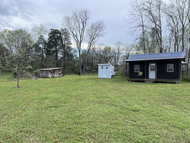1737 Bratton Ln, Williamsport, TN 38487 - view of yard with a shed and an outbuilding
