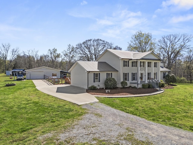 1737 Bratton Ln, Williamsport, TN 38487 - neoclassical / greek revival house featuring gravel driveway, an outbuilding, metal roof, a garage, and a front yard