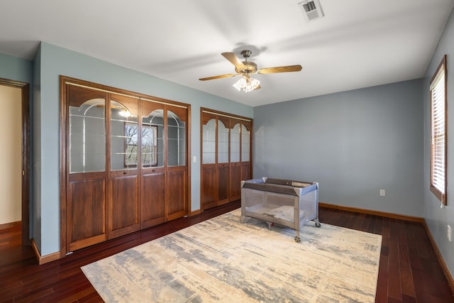1737 Bratton Ln, Williamsport, TN 38487 - interior space featuring visible vents, a ceiling fan, dark wood finished floors, and baseboards