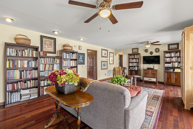 1737 Bratton Ln, Williamsport, TN 38487 - living area with visible vents, ceiling fan, hardwood / wood-style floors, baseboards, and arched walkways