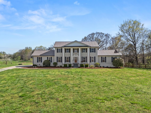 1737 Bratton Ln, Williamsport, TN 38487 - greek revival house with fence, metal roof, and a front yard