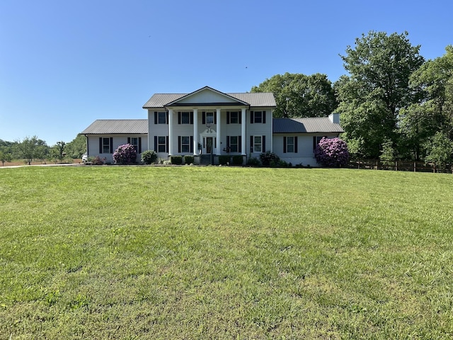 1737 Bratton Ln, Williamsport, TN 38487 - greek revival house with covered porch, a front yard, and metal roof