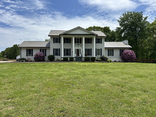 1737 Bratton Ln, Williamsport, TN 38487 - greek revival inspired property featuring a porch, a front lawn, and metal roof