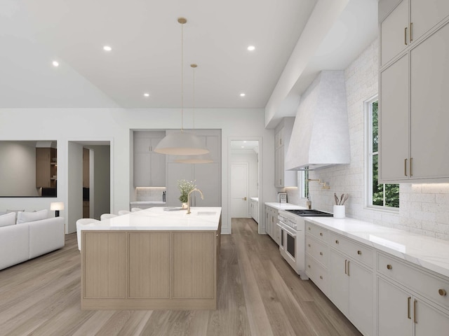 544 Bonaire Ln, Franklin, TN 37064 - kitchen with high end white range, wall chimney exhaust hood, tasteful backsplash, light wood-style flooring, and a kitchen island with sink