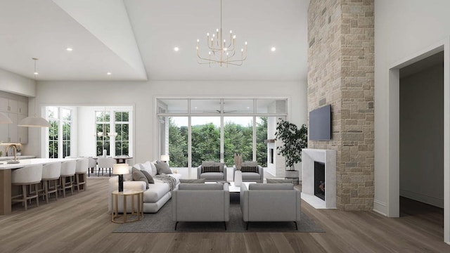 544 Bonaire Ln, Franklin, TN 37064 - living area with wood finished floors, a chandelier, recessed lighting, a fireplace, and lofted ceiling