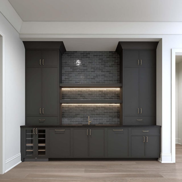 544 Bonaire Ln, Franklin, TN 37064 - bar featuring light wood-style floors and backsplash