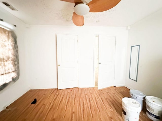empty room with light wood-type flooring and visible vents