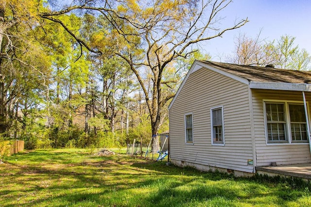 view of home's exterior with a yard and crawl space