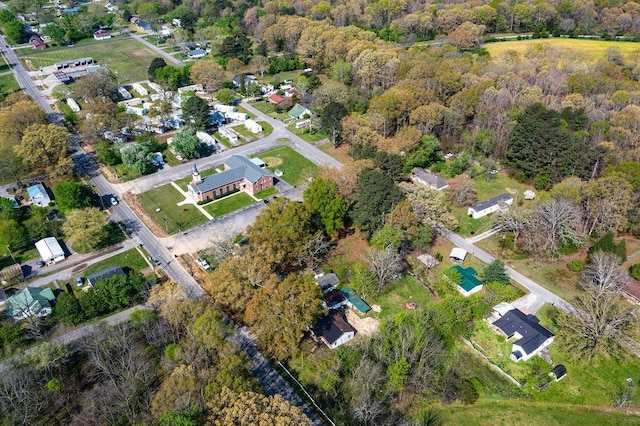 drone / aerial view featuring a forest view