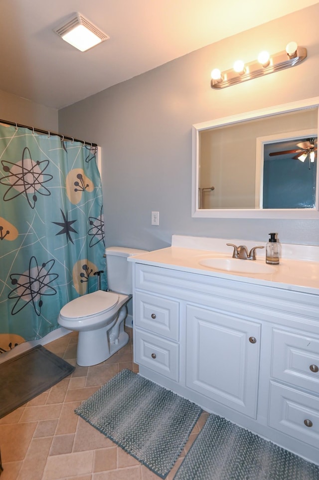 602 Bradburn Village Cir, Antioch, TN 37013 - bathroom with a shower with curtain, toilet, vanity, and tile patterned floors