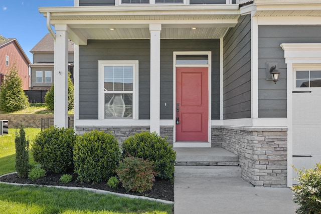 doorway to property with stone siding