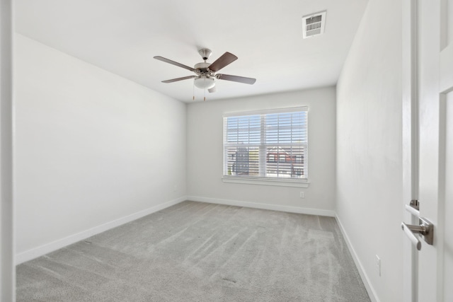 carpeted empty room with ceiling fan, baseboards, and visible vents
