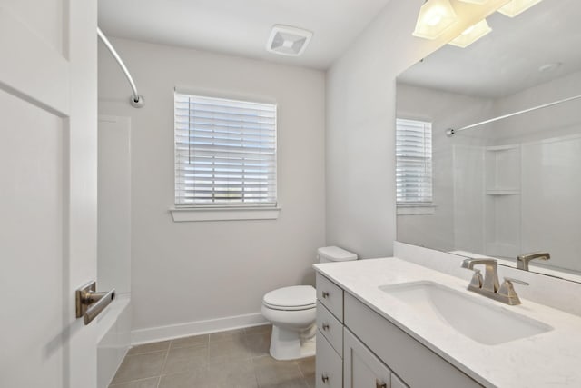 bathroom with vanity, baseboards, bathing tub / shower combination, tile patterned flooring, and toilet