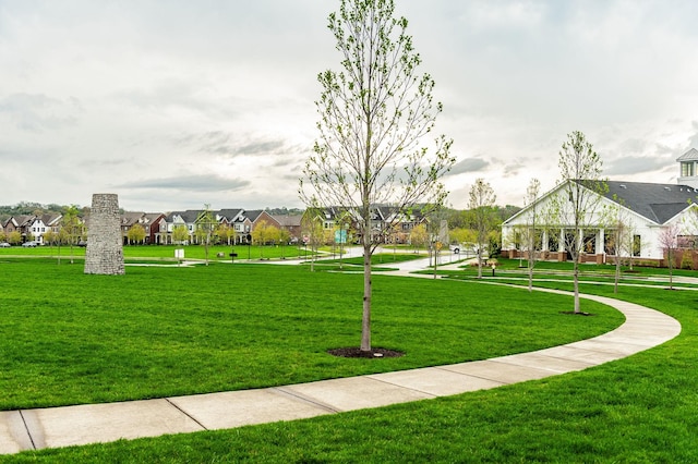 surrounding community featuring a lawn and a residential view
