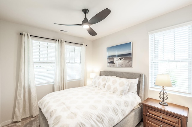 bedroom featuring visible vents and a ceiling fan