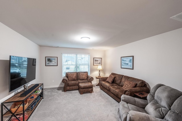 living area featuring baseboards, carpet flooring, and visible vents