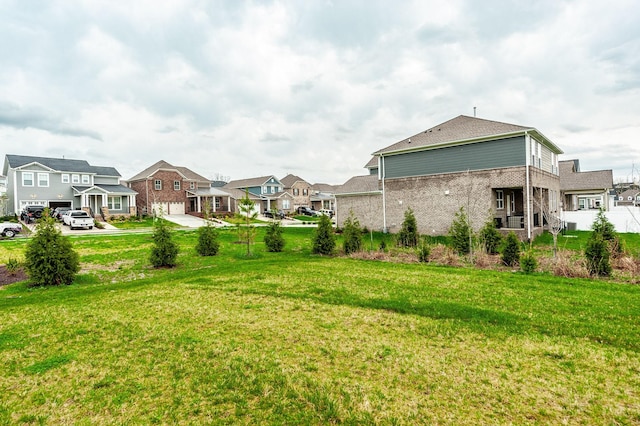 view of yard featuring a residential view