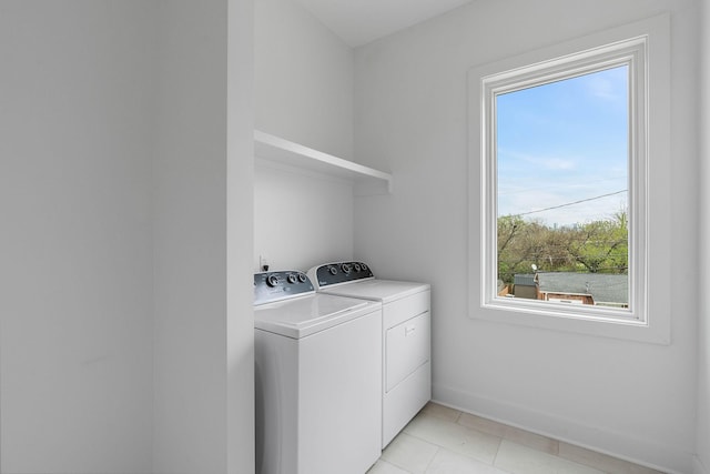 807 32nd Ave N Unit A, Nashville, TN 37209 - laundry area featuring light tile patterned flooring, washer and clothes dryer, baseboards, and laundry area
