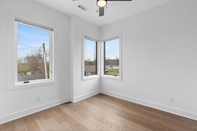807 32nd Ave N Unit A, Nashville, TN 37209 - unfurnished room featuring baseboards, visible vents, wood finished floors, and plenty of natural light