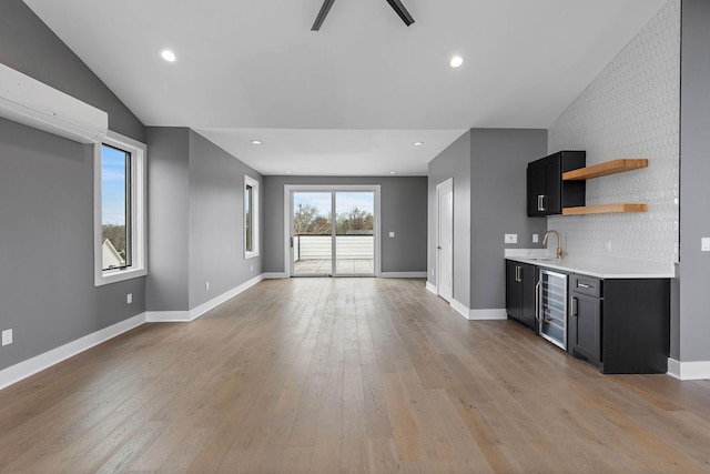 807 32nd Ave N Unit A, Nashville, TN 37209 - interior space with light wood-style flooring, baseboards, wet bar, a sink, and beverage cooler