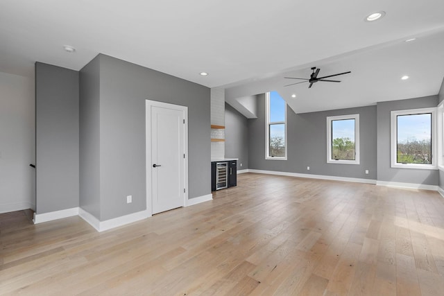 807 32nd Ave N Unit A, Nashville, TN 37209 - unfurnished living room featuring baseboards, a ceiling fan, and light wood finished floors