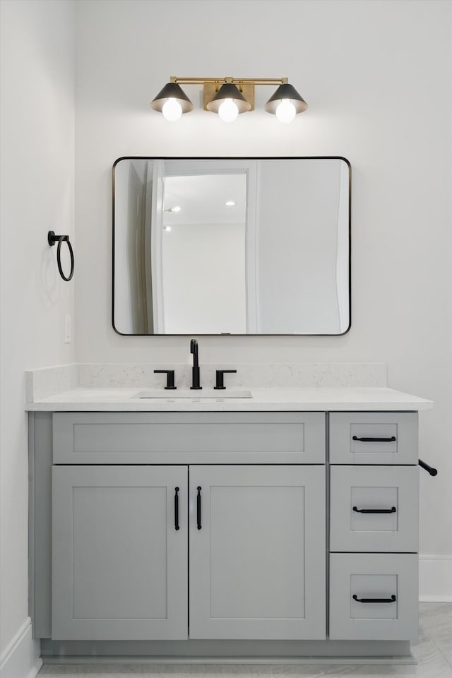 bathroom featuring vanity and baseboards